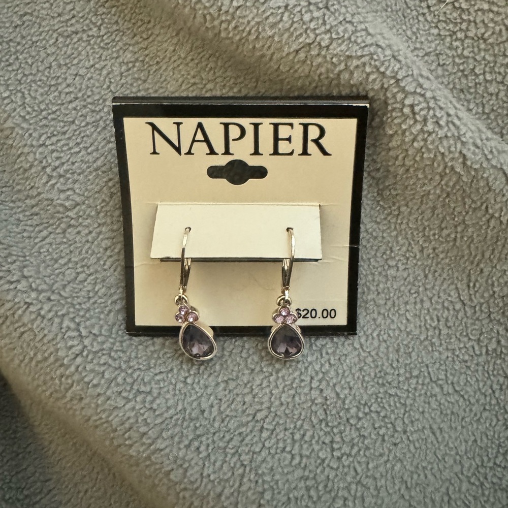 Brand new sterling silver dangle earrings. Purple gemstones